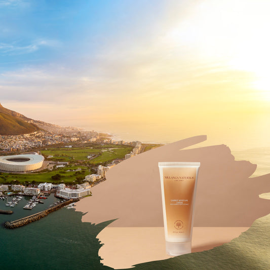 Mulanga Naturals' Carrot Moisture Crème with a background picture of the City of Cape Town